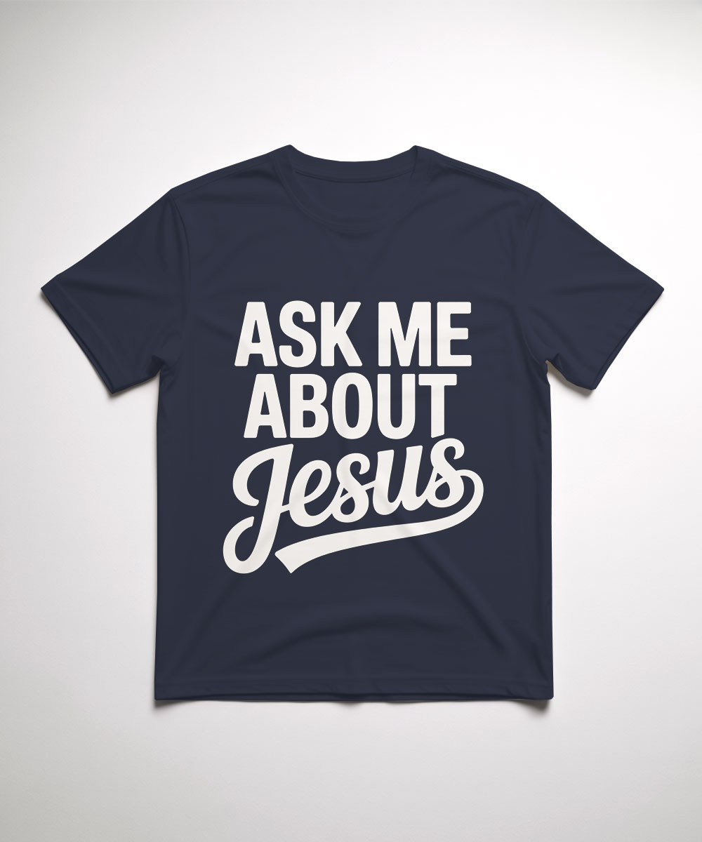 A navy blue "Ask Me About Jesus Christian T-Shirt" laid flat, featuring a white retro script font designed as a conversation starter.