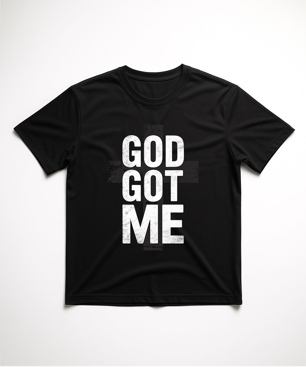 A black "God Got Me Christian T-Shirt" laid flat, featuring a bold, white, minimalist font with a subtle cross detail.