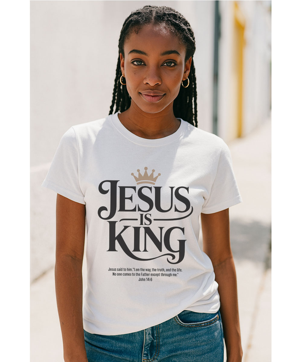 jesus-is-king-t-shirt-for-women-white-worship-tee A woman who appears to be Black, with braids, models the "Jesus is King Christian T-Shirt" outdoors.