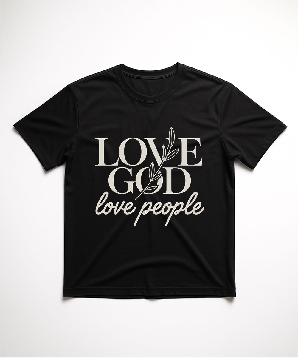 A black "Love God Love People Christian T-Shirt" laid flat, featuring a mix of script and serif fonts with a botanical branch graphic.
