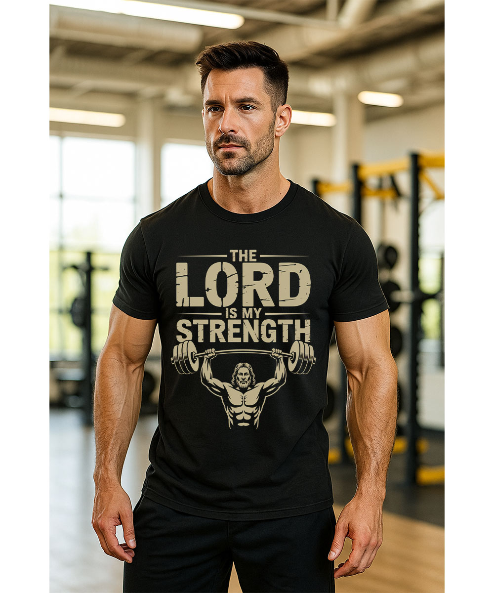 A man with a beard shows off the "The Lord is my Strength" Christian t-shirt in a modern gym.