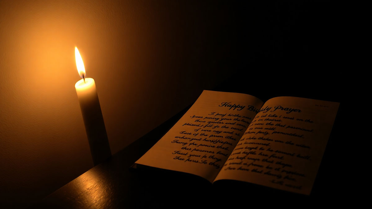 A single candle burning in a quiet room, symbolizing finding hope and peace with a touching birthday prayer for strength.