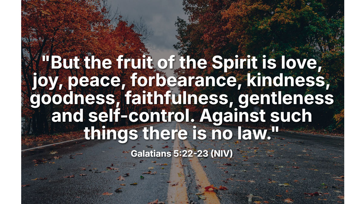 Bible verse about kindness from Galatians 5:22-23 showing the fruit of the Spirit including love, joy, peace, and gentleness on an autumn road background