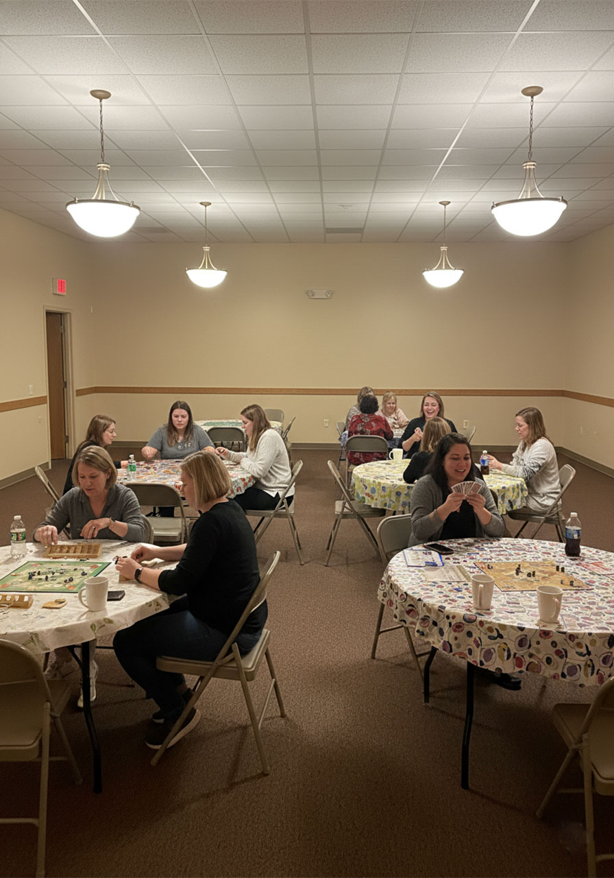 Women playing board games together at a church ladies ministry game night