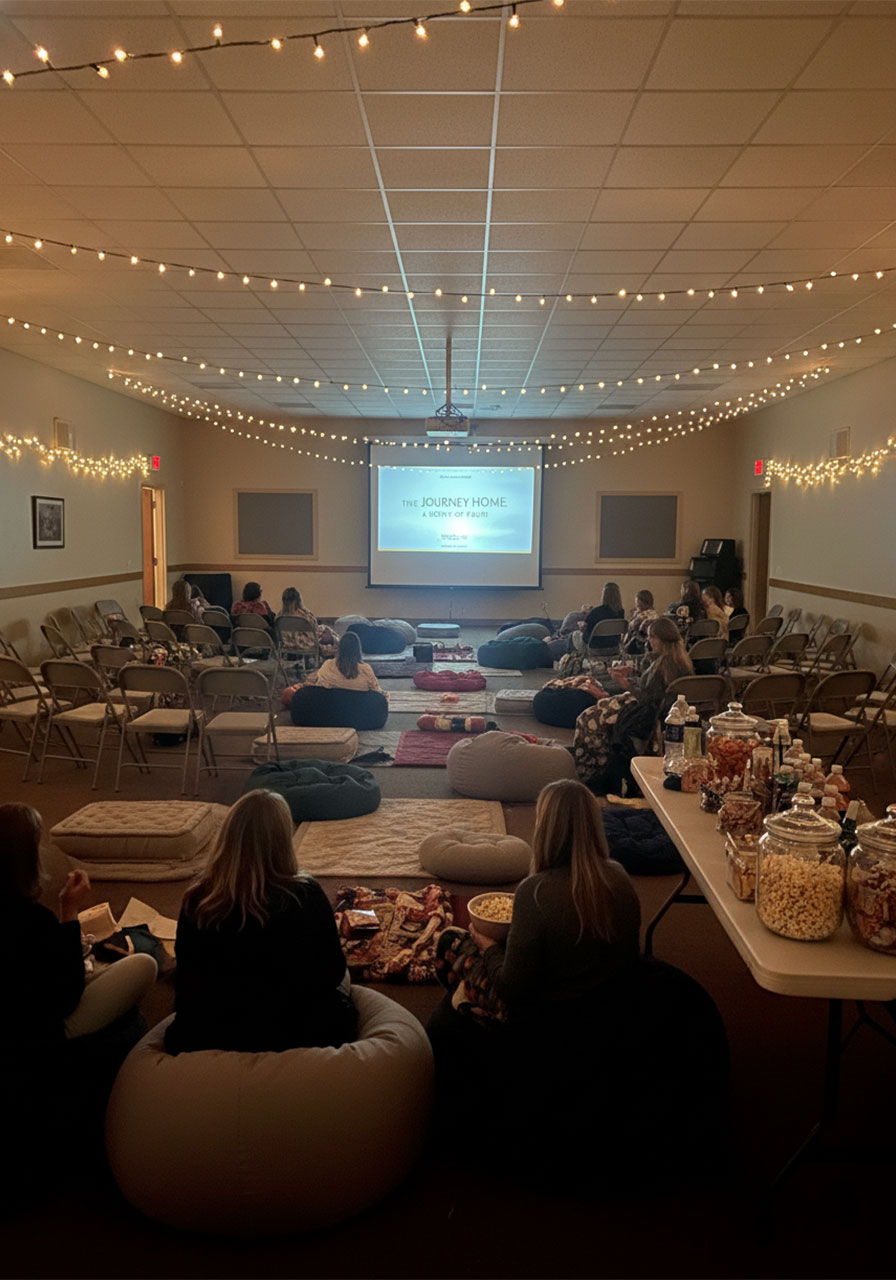 Women enjoying a movie night at a cozy church ladies ministry fellowship event