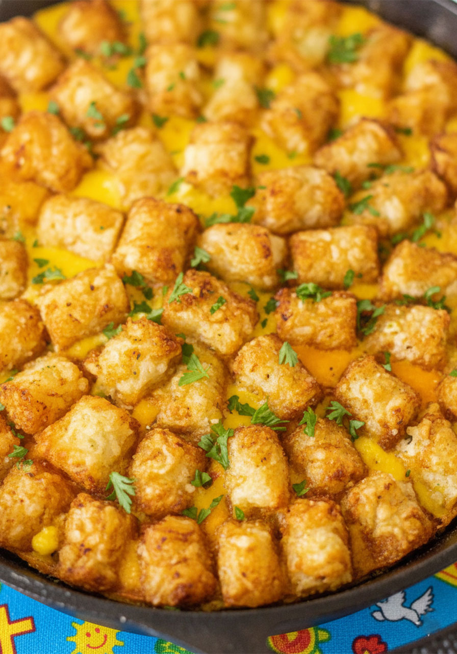 Cozy Christian morning brunch table with vegan tater tot casserole open Bible and warm coffee creating a peaceful breakfast setting